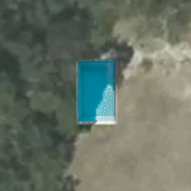 A rectangular pool rendered into a real backyard